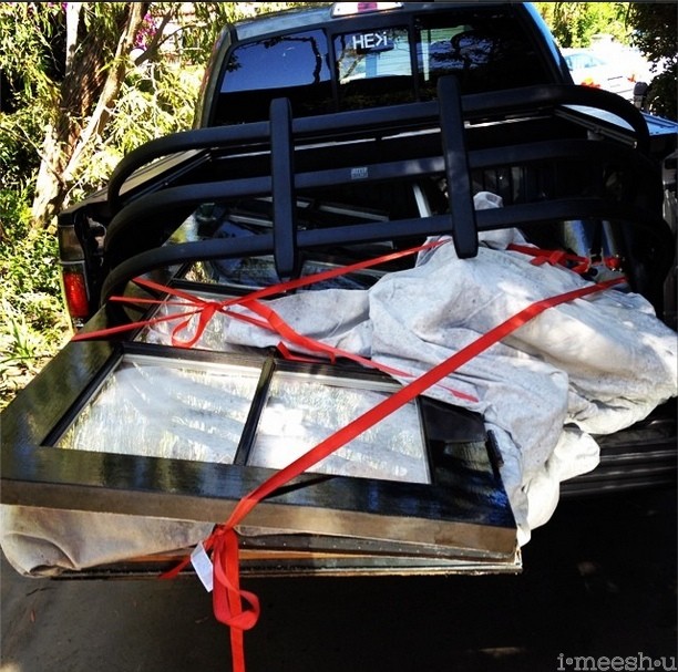 old windows in back of a truck